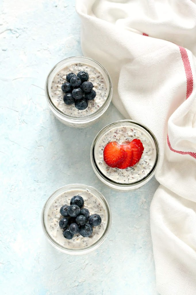 Three jars of Easy Overnight Oats topped with berries.
