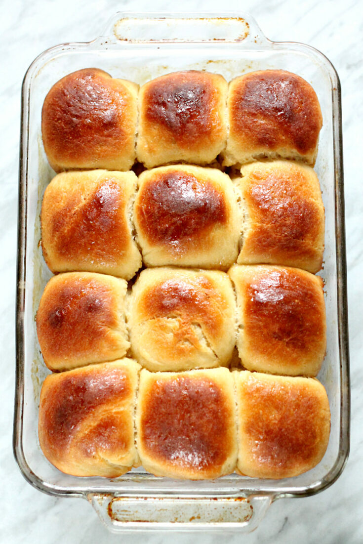 A rectangular baking dish with Honey Yeast Rolls